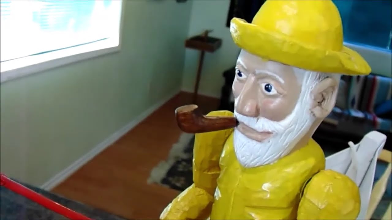 Man rowing a boat whirligig, sailor rowing a boat whirligig