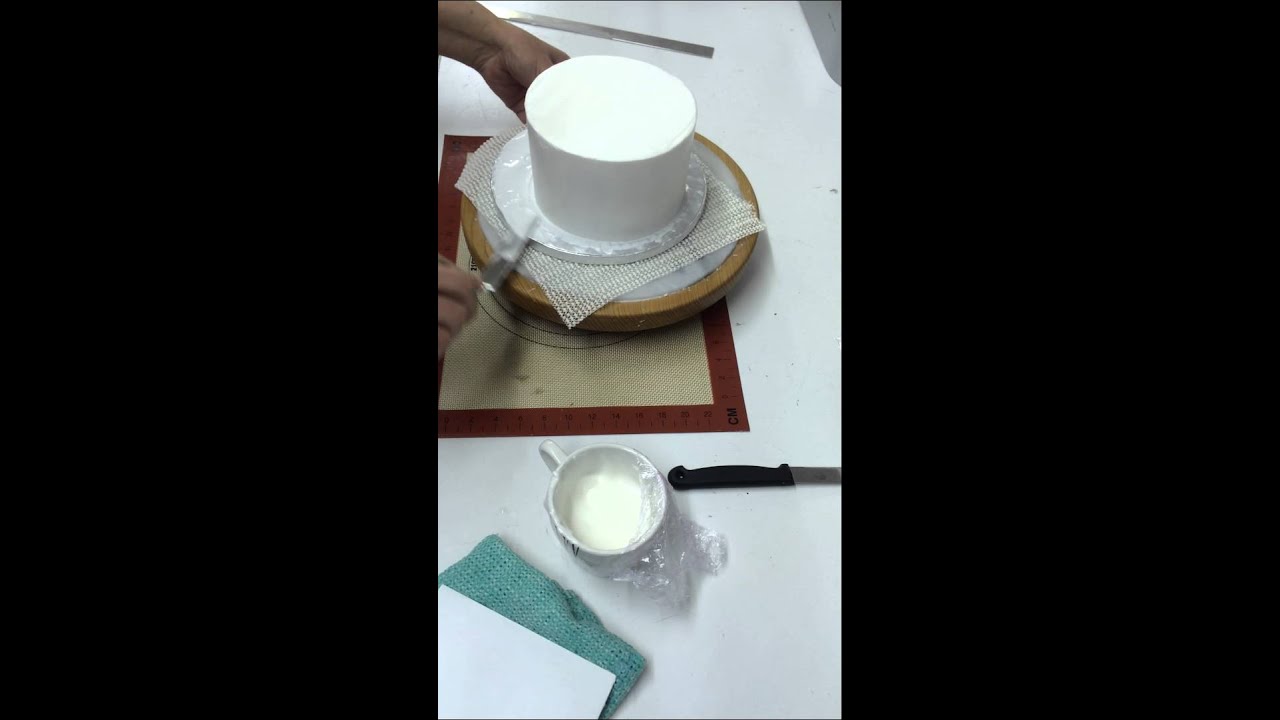 How to cover a rich fruit cake with royal icing ( 3rd layer ) & coat the board