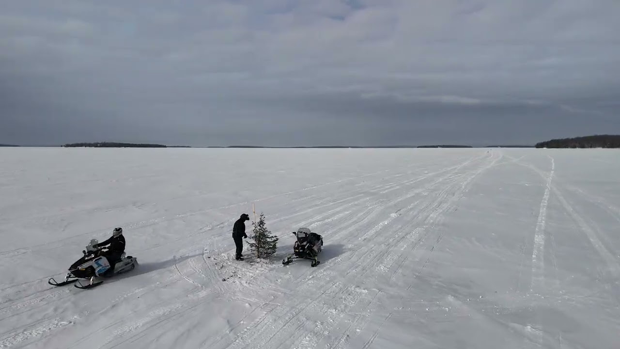 Snowmobilers cross international ice bridge connecting the U.S. and Canada
