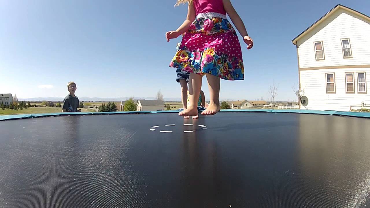 Small Girls Jump on Trampoline on Butt