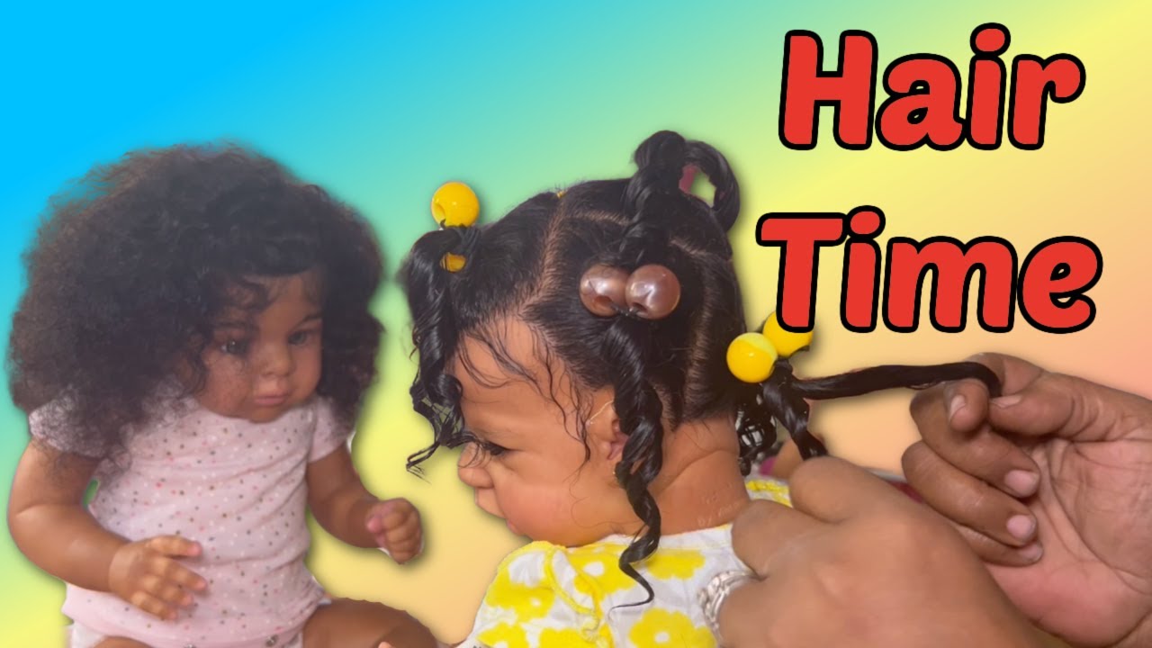 Doing reborn baby twins hair in ponytails
