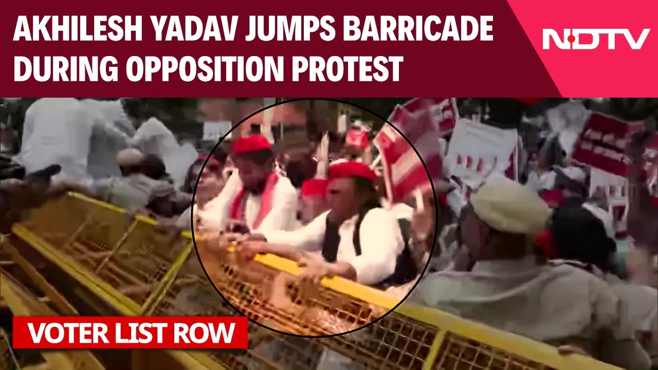 Akhilesh Yadav Jumps Police Barricade During Opposition Protest