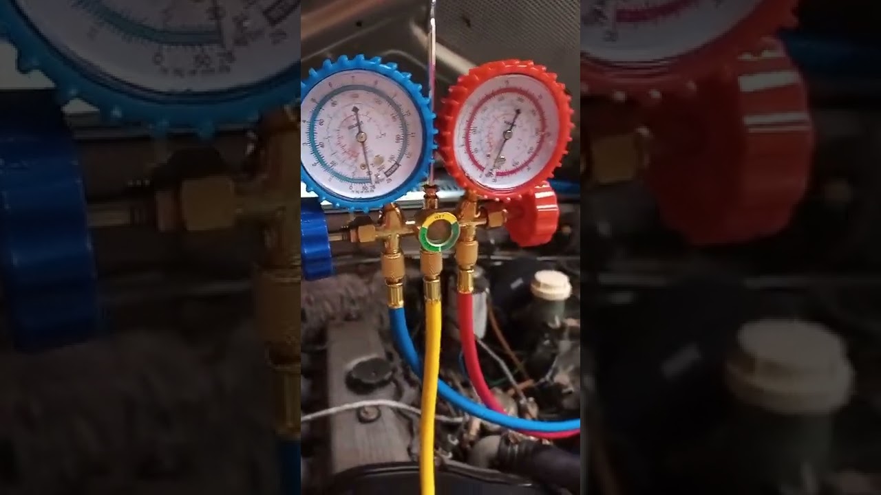 Dando vácuo no sistema e colocando gás R134 no ar condicionado da L200 quadrada