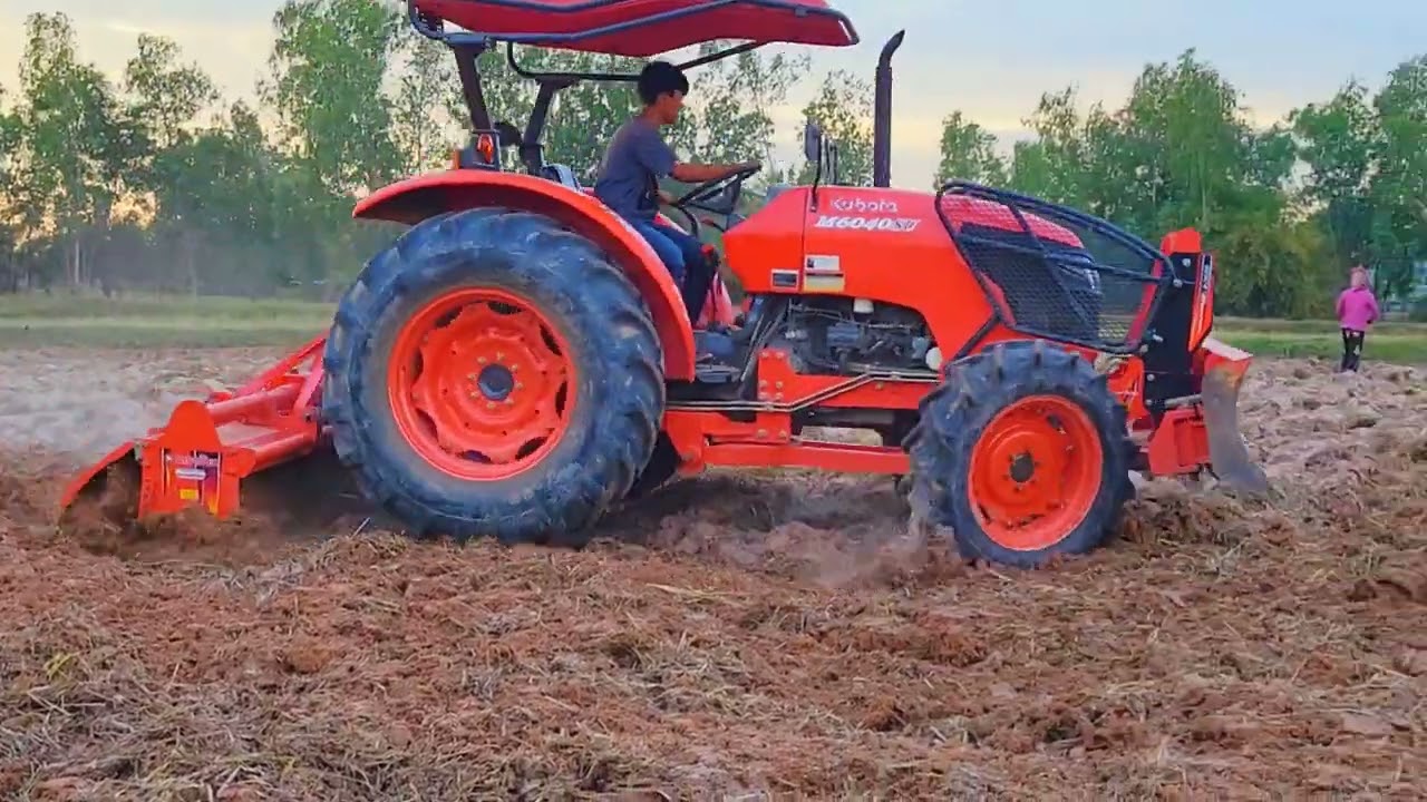 Tractor Kubota M6040 Plowing Best Performance Trailer. Famer Agriculture