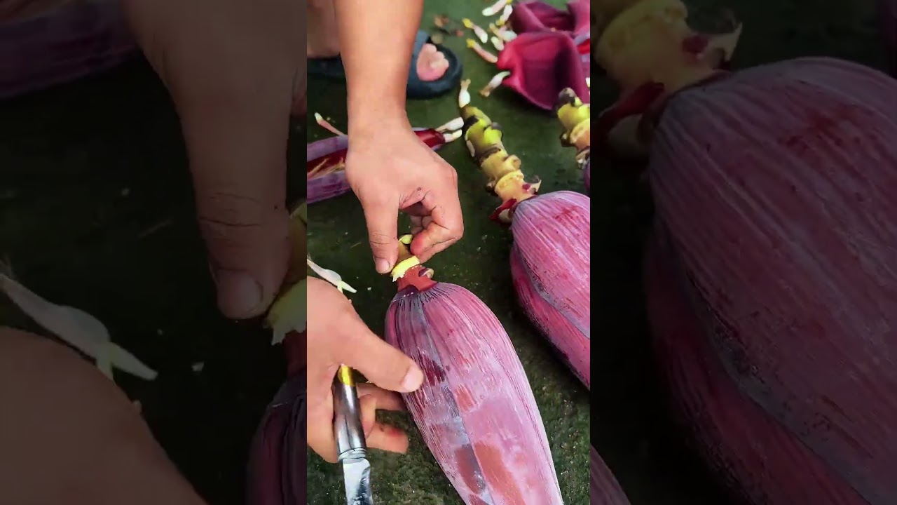 Peeling banana heart with knife 