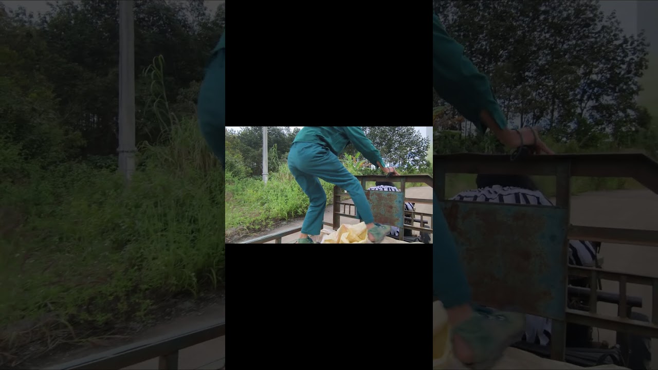 Police officers chasing robbers jumped onto a farm vehicle to subdue the criminals.