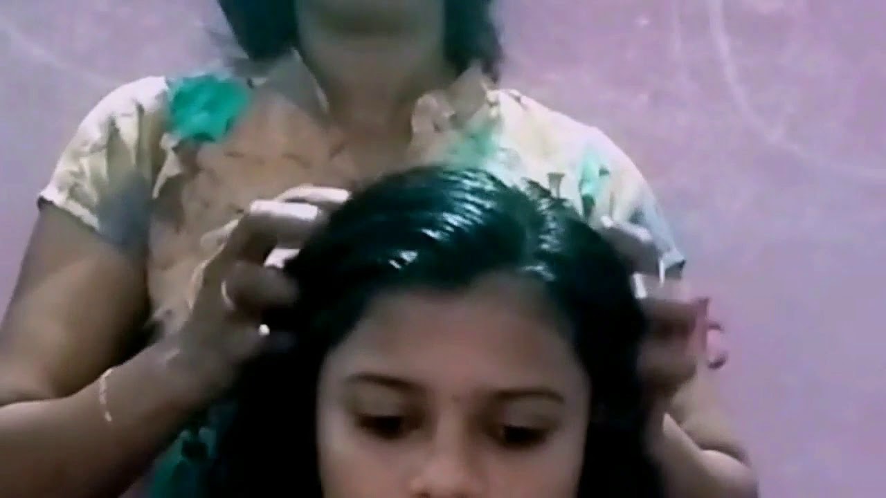 Hot oil hair massage at home .