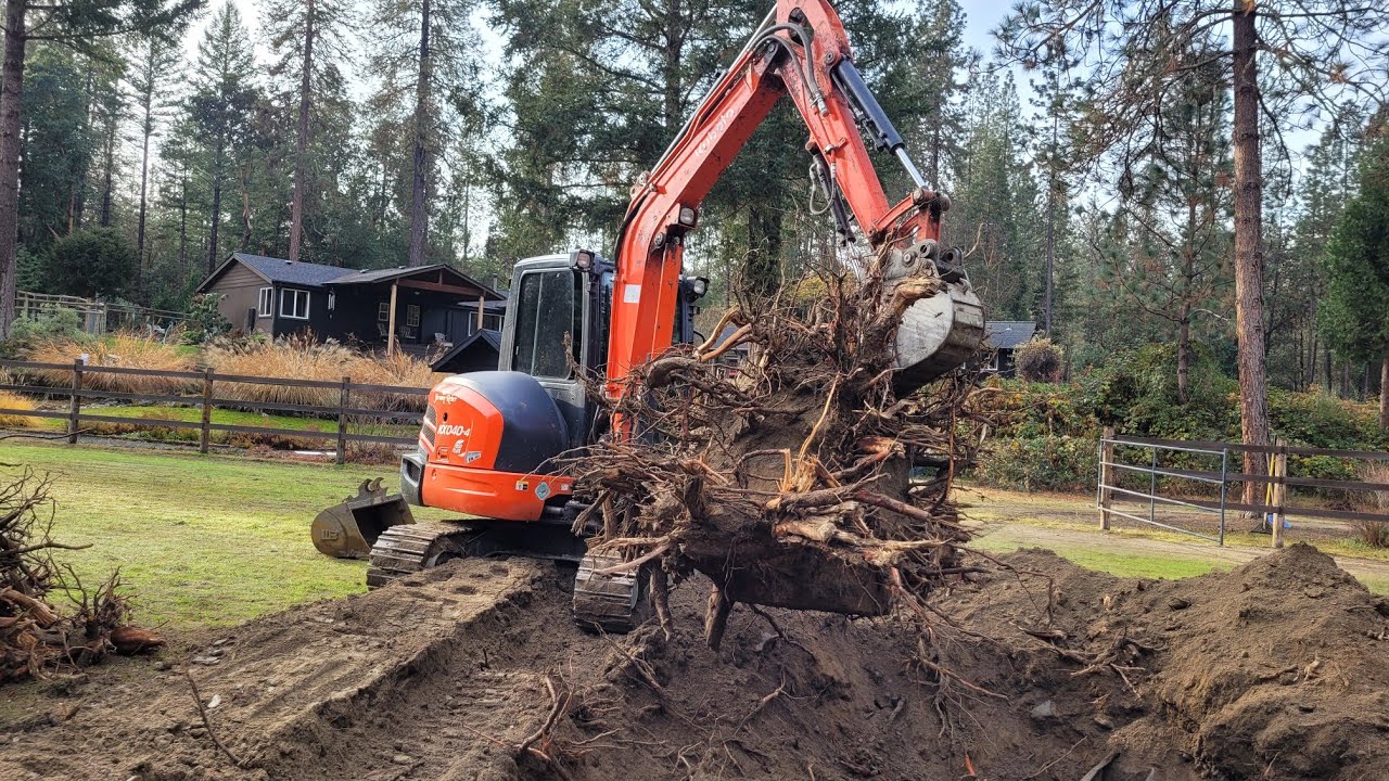 Big stump digging with the Kubota KX-040