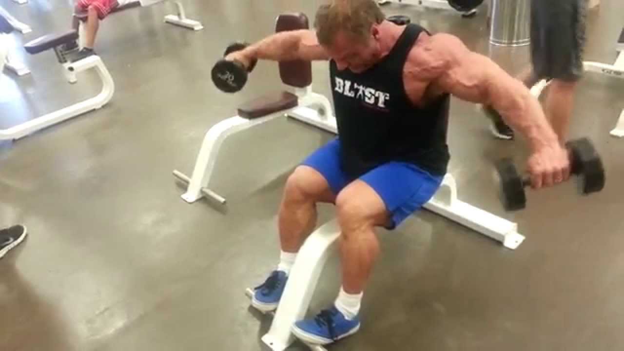 Seated side laterals with a forward lean
