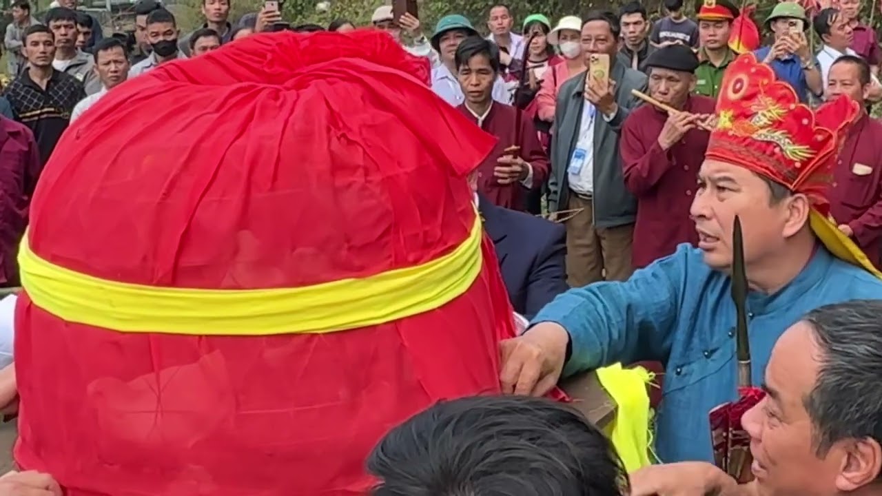 The shamans of the ethnic group are performing a ritual to release birds into the sky.