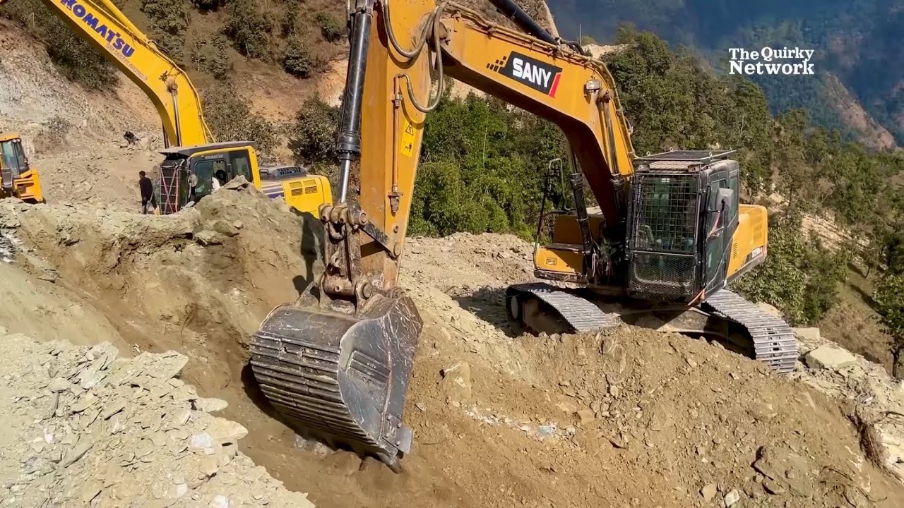 Sany SY210C-9 and Komatsu Excavator Constructing a Road in a Dangerous Area