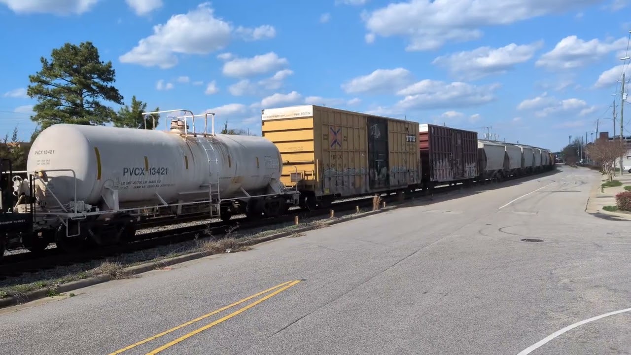 CSX 7278 and CSX 3219 lead a long south bound mixed freight down Winslow Street 3/10/2026