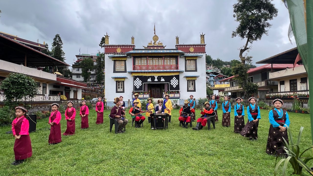 Presenting Toeshay Dawae Shhonu on the 90th Birthday celebration of H. H. The 14th Dalai Lama .