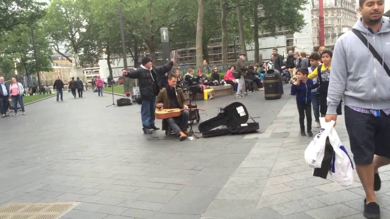 London street performer fights homeless man