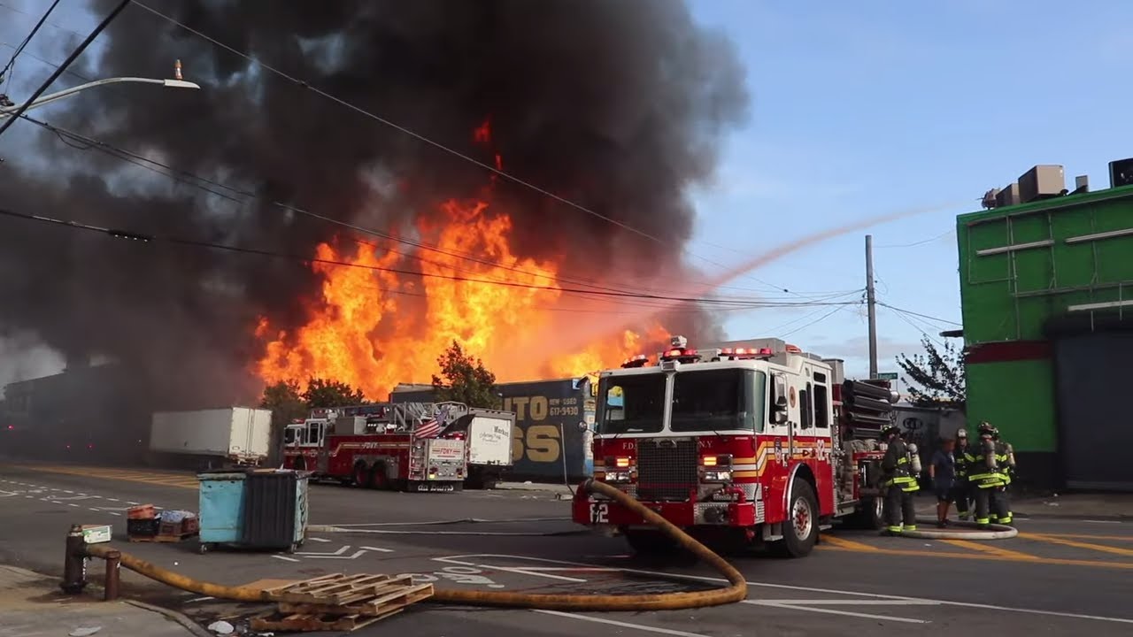 FIRE IN THE BRONX !! FDNY battles a BLAZING 5th Alarm FIRE in a pallet yard. Huge flames melt cars !
