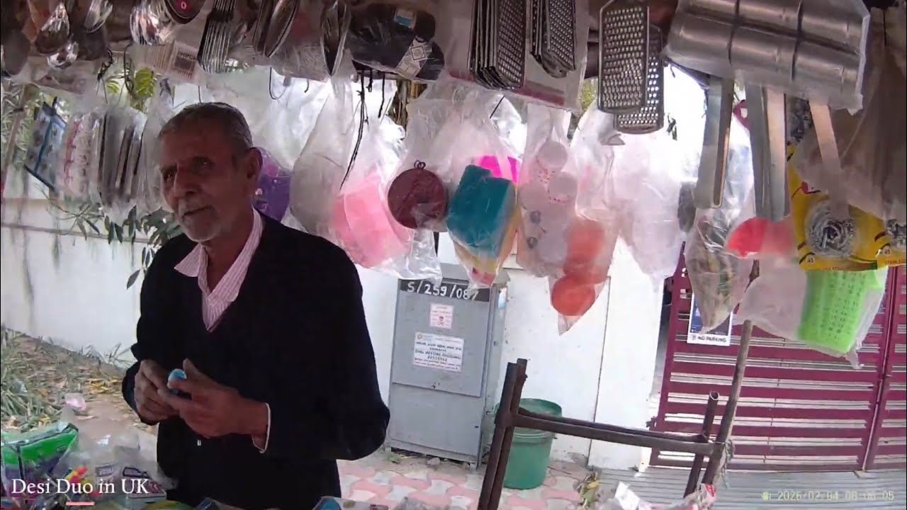 Hardworking Elderly Street Vendor Pulling a Heavy Cart in Ahmedabad