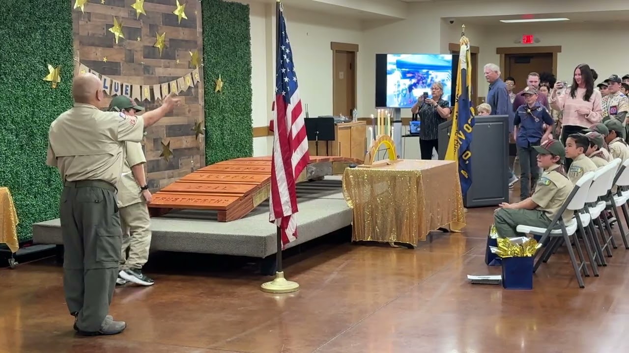 Finn walks The Bridge to Boy Scout Pack 700