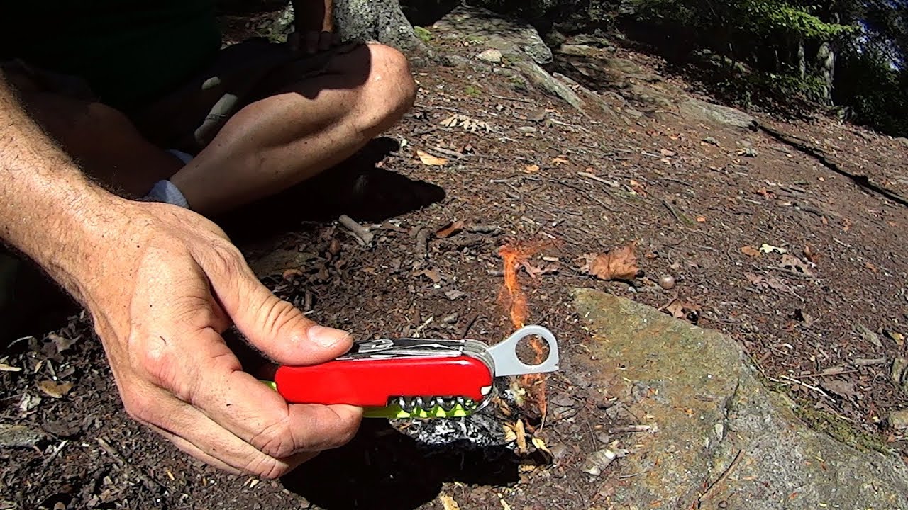 Victorinox SAK Magnifying Lens Firecraft in the Woods.