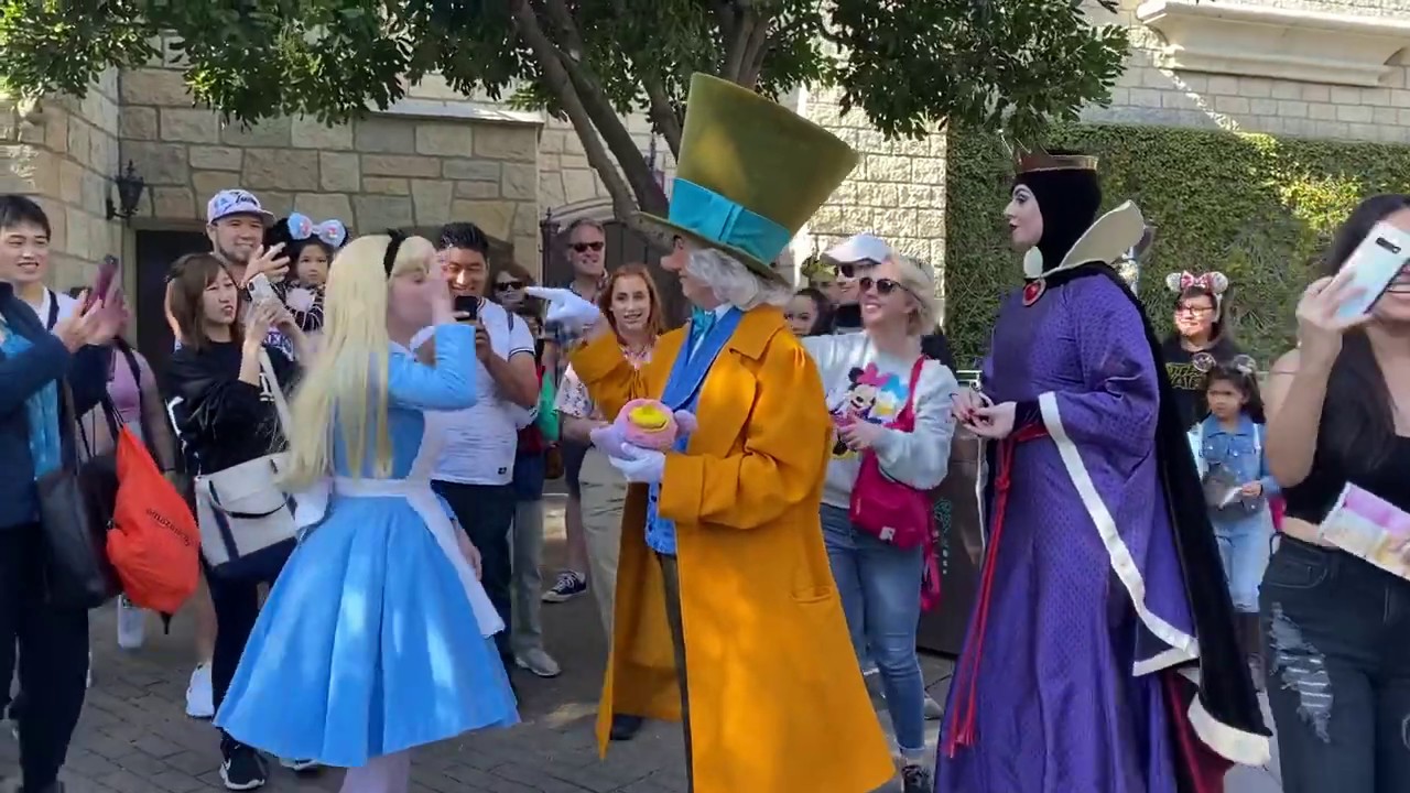 Alice, Mad Hatter, and the Evil Queen in Fantasyland - Disneyland Resort