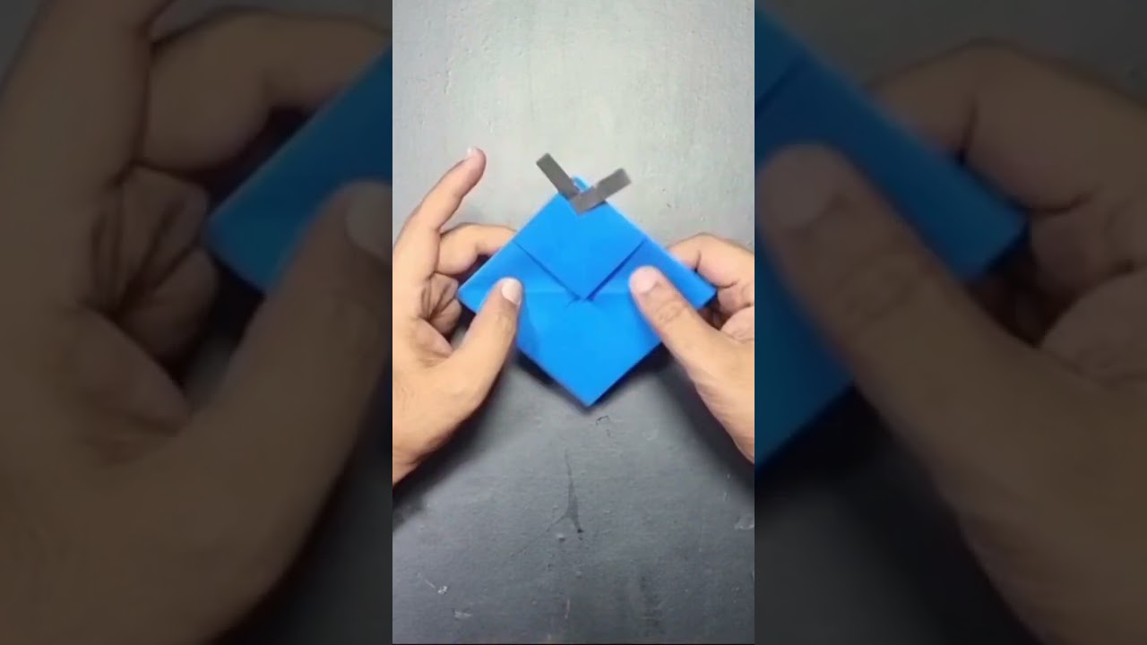 Origami - mouth open fish with paper