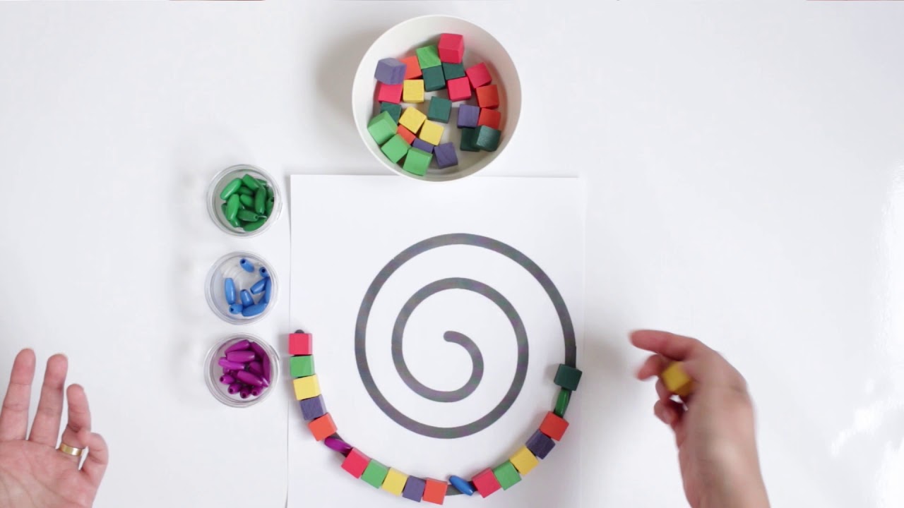 Easy shape activity for pr&eacute;-kindergarten kids using a spiral shape and colored wooden beads