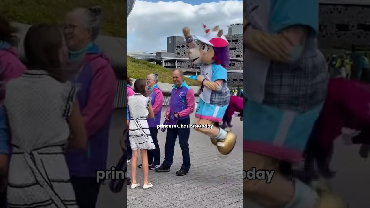 princess Charlotte having fun with mascot