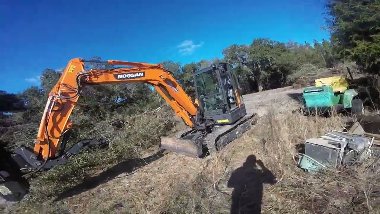 Doosan DX63 mini excavator with forestry mower head