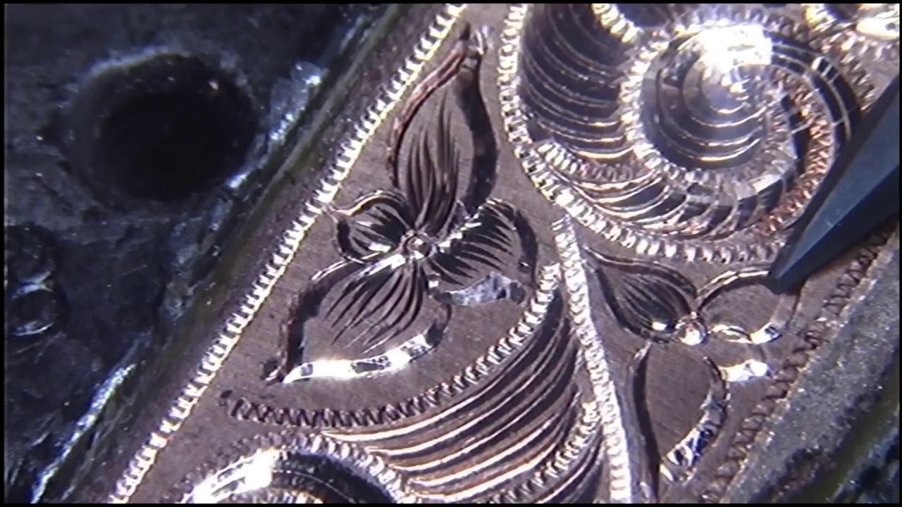 Hand engraving Western scrolls and flowers. bright cuts and shading