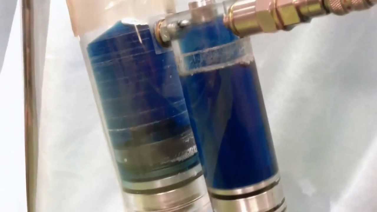 Vacuum evacuating and filling shockabsorber with oil