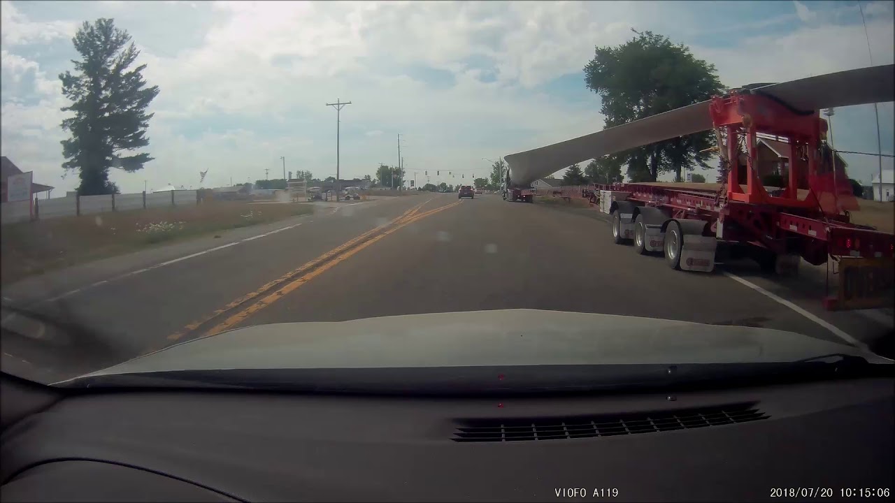 Passing by windmill blade on trailer