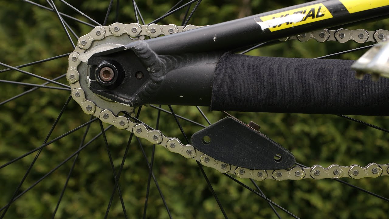 Trials bike sprung chain tensioner - axle mount (see description)