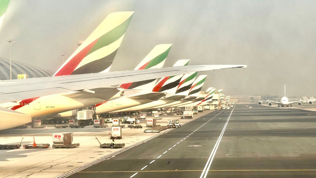 Emirates 777-300 Lisbon Portugal to Dubai UAE HDR 4K video Burj Khalifa plane View