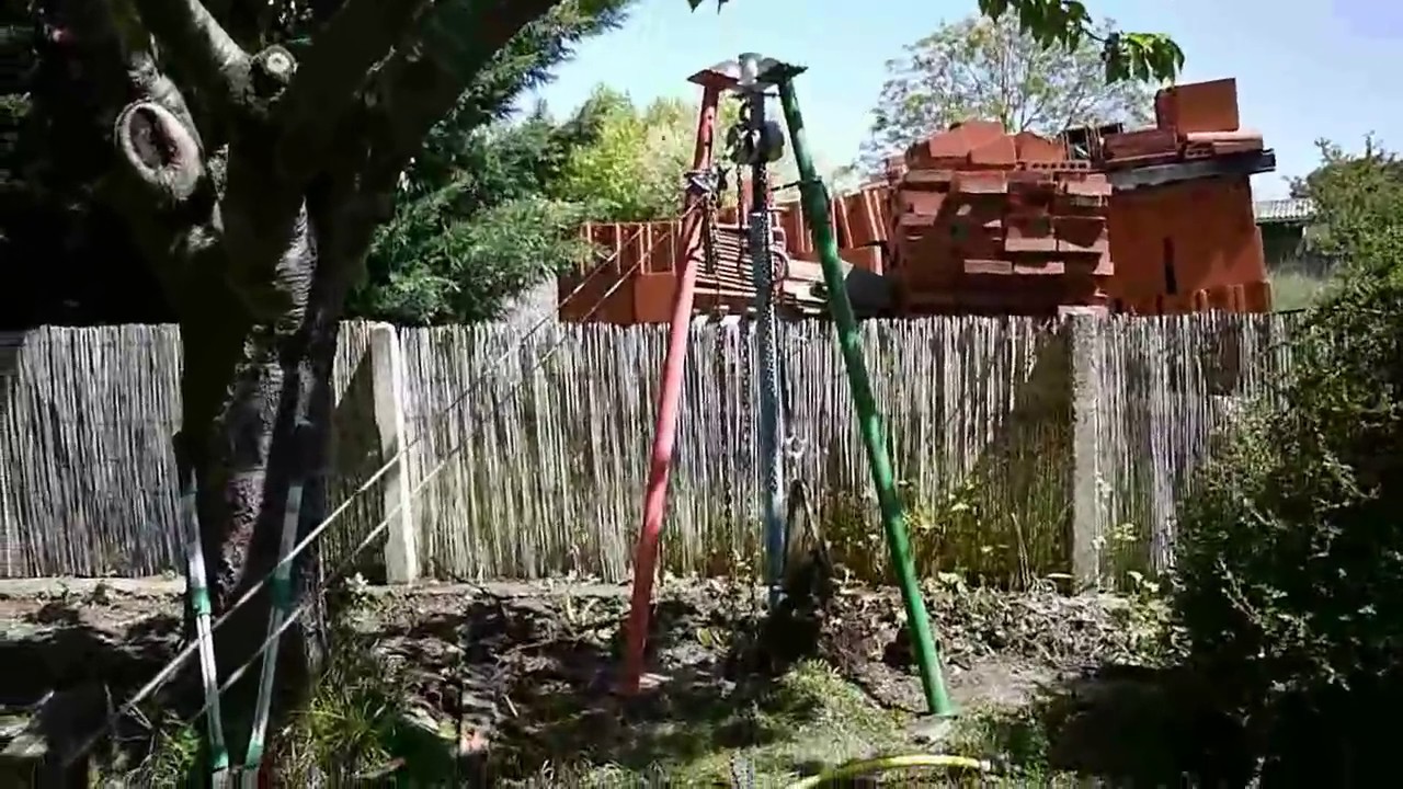 Arrachage de souches de laurières à l'aide d'un palan manuel et électrique
