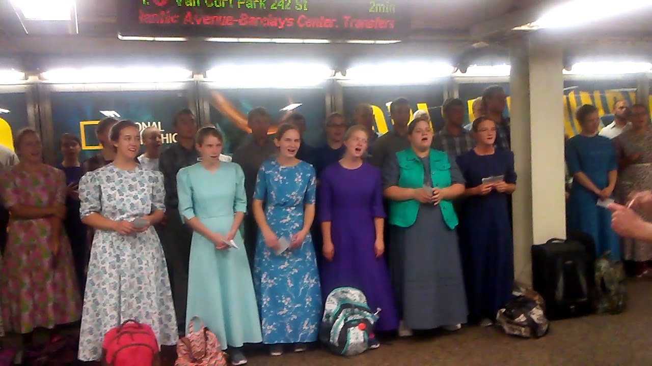 Amish back in Times Square Subway station singing again.