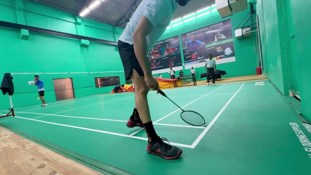 Singles Badminton Match at Office court 