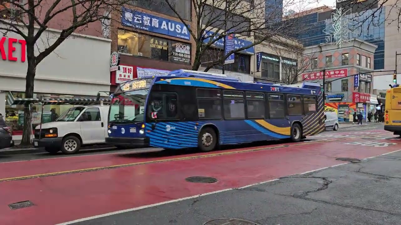 Various buses running along Main Street in Flushing, Queens (December 2025)