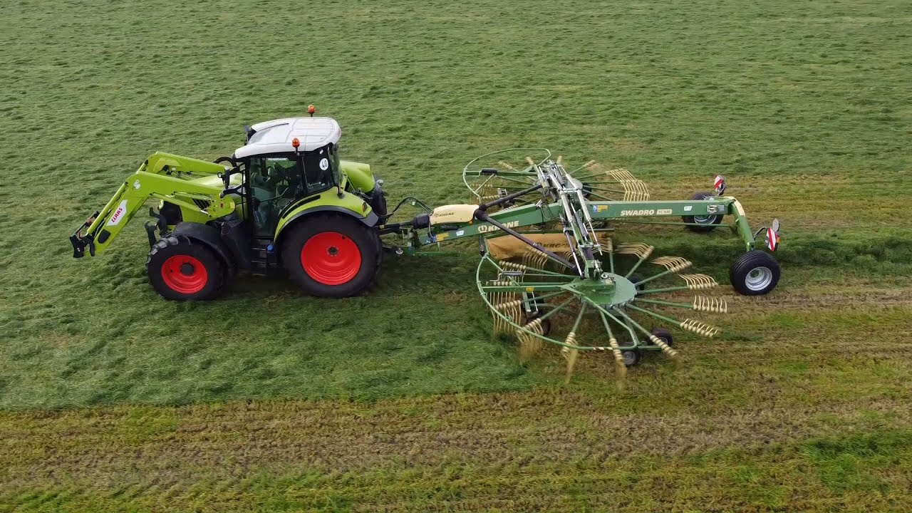 Raking silage Claas & Krone
