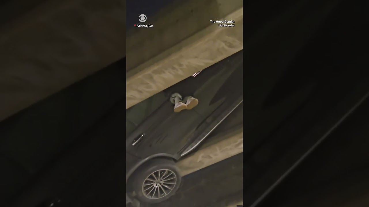 Driver seen dangling from car after car crash #shorts
