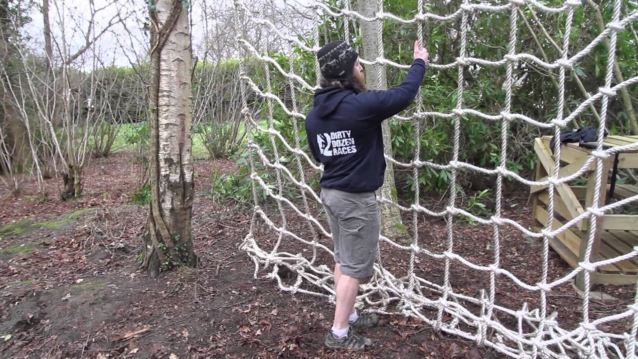 How to climb a vertical cargo net at an obstacle race