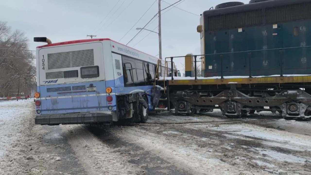 Train hits city bus in Grand Rapids