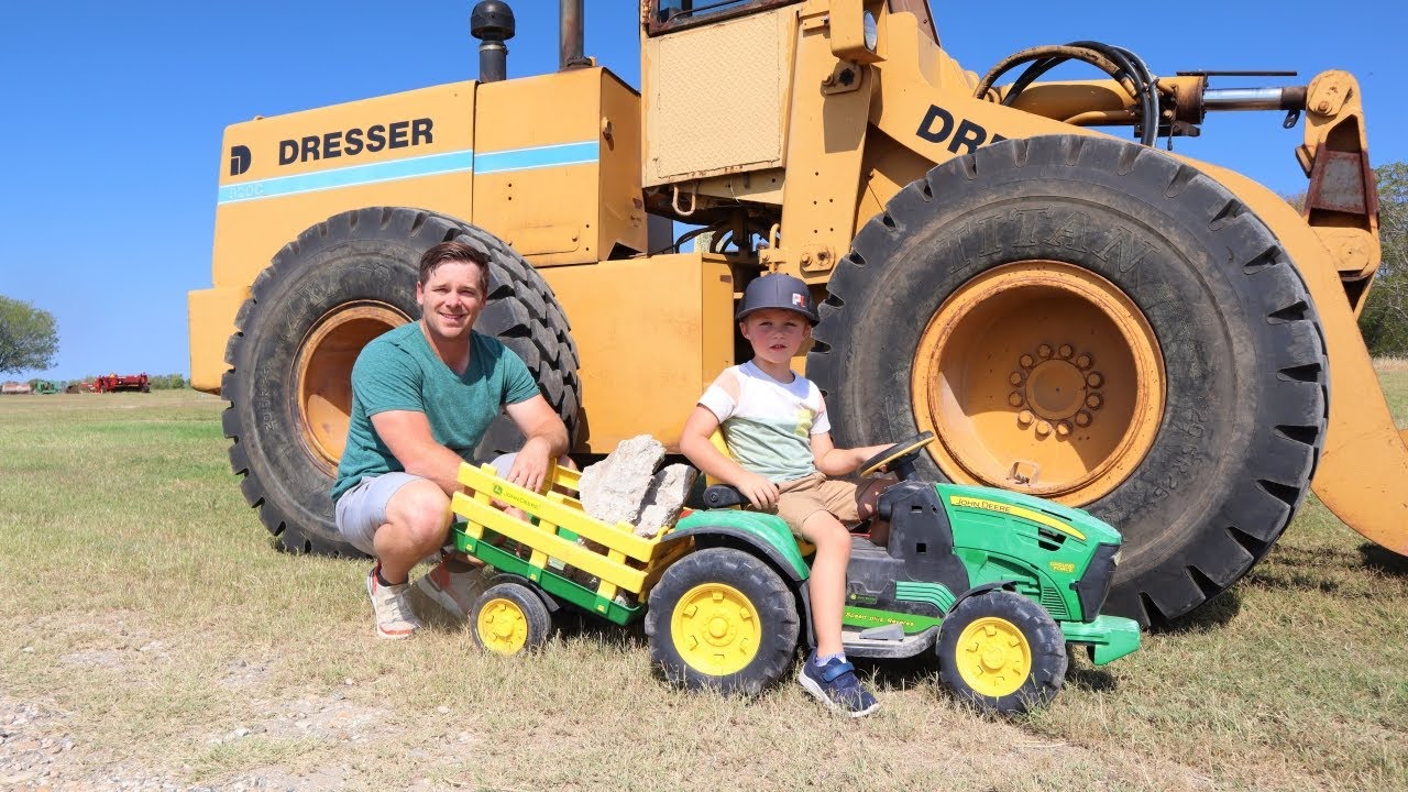 Using real tractors to move rocks on the farm | Tractors for kids | Working on the farm