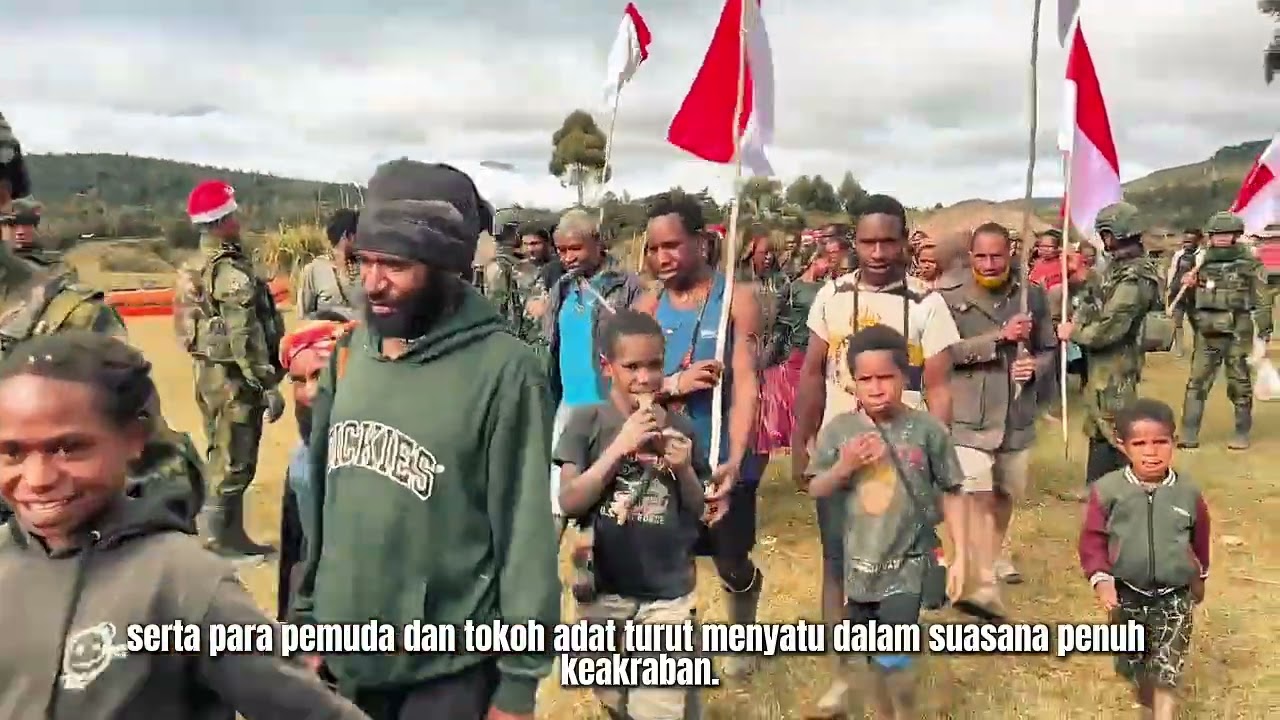 NATAL PENUH KEHANGATAN, SATGAS YONIF 408/SBH JALAN SEHAT DAN LOMBA BERSAMA WARGA ANDUGUME