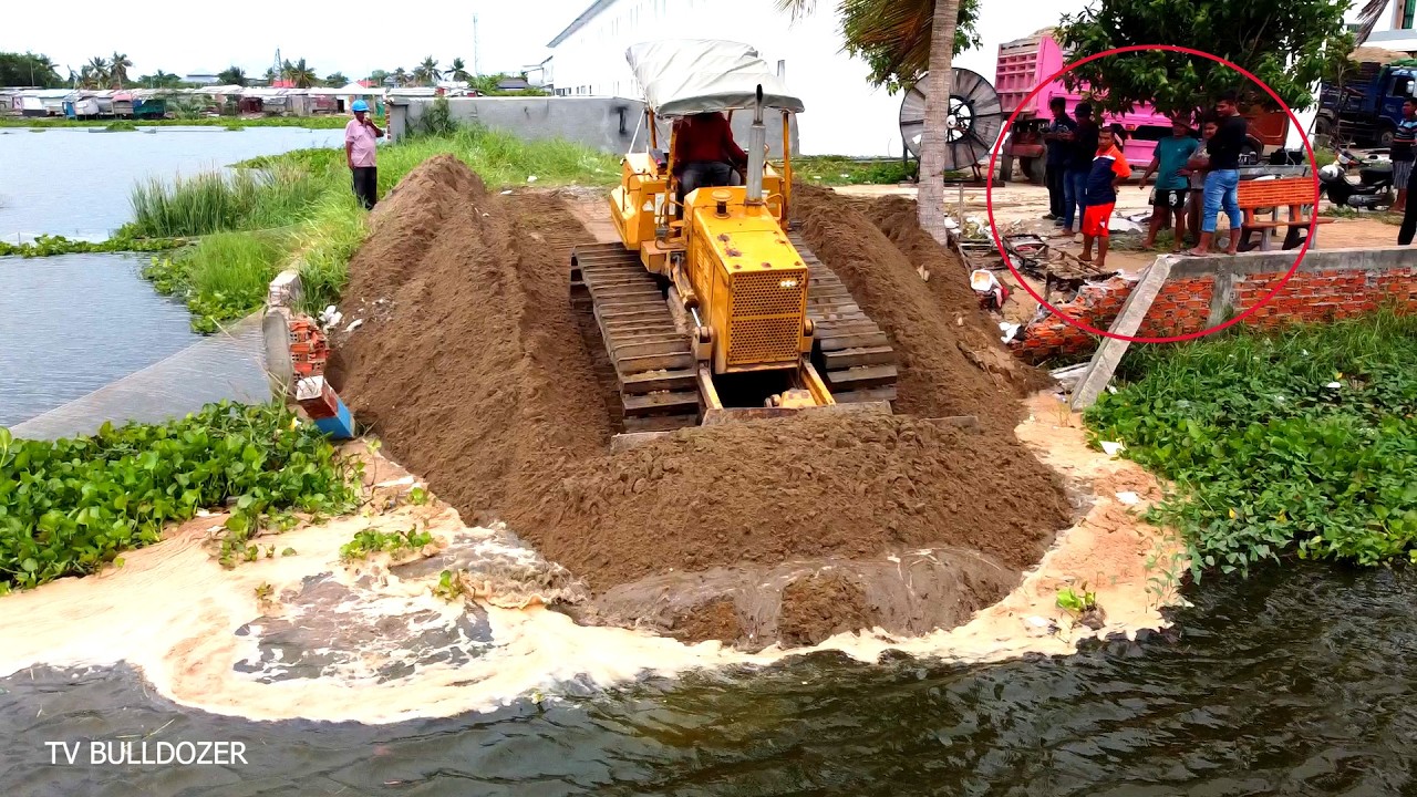 Starting New Project Connecting New Road Crossing Lake By Komat'su D31P Dozer & Team Truckloads Sand