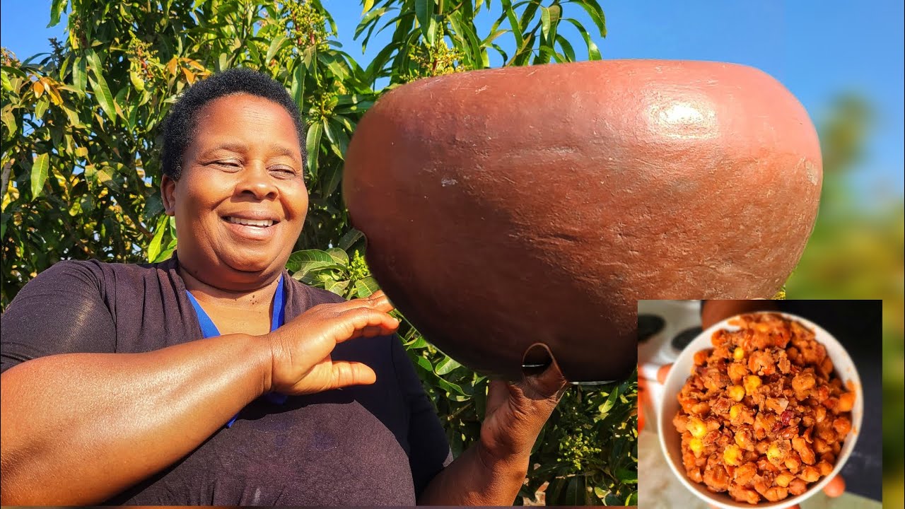 Zimbabwean village mom cooking mutakura : Corn and nuts mix
