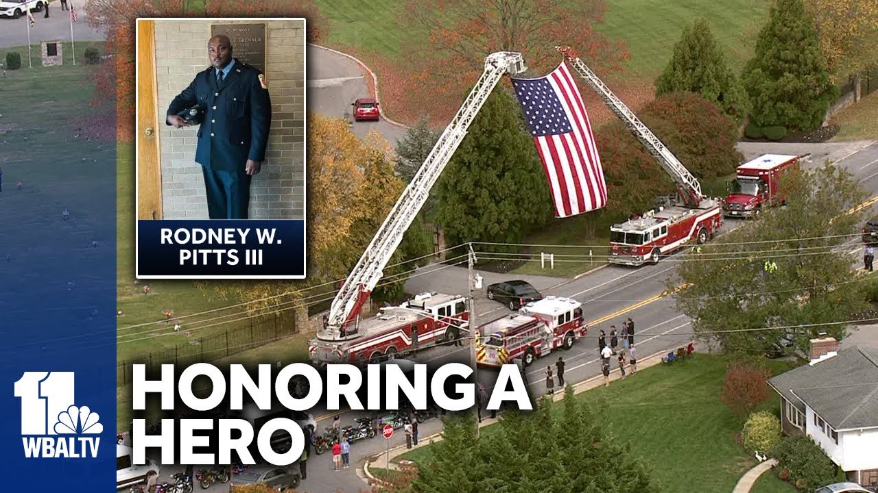 Street lined with supporters for firefighter funeral procession
