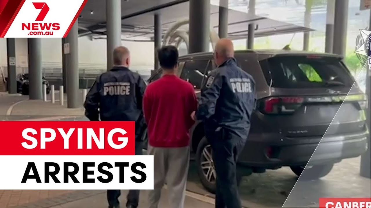 Chinese nationals arrested over Canberra spying allegations | 7NEWS