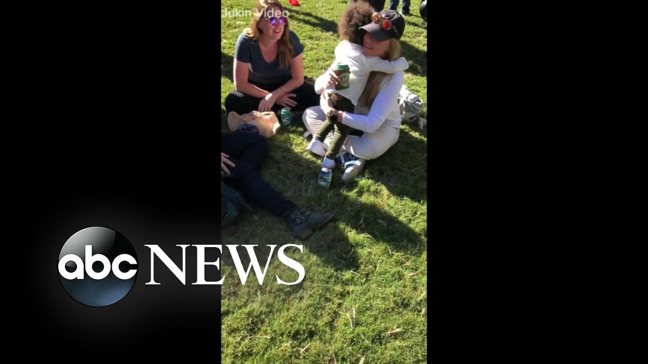 Toddler offers free hugs to strangers at Atlanta festival