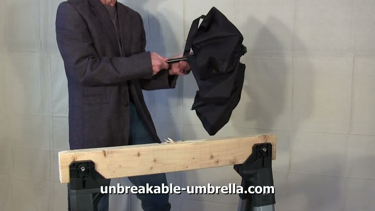 UZI&reg; Tactical Collapsible Umbrella vs Two-by-Four (2