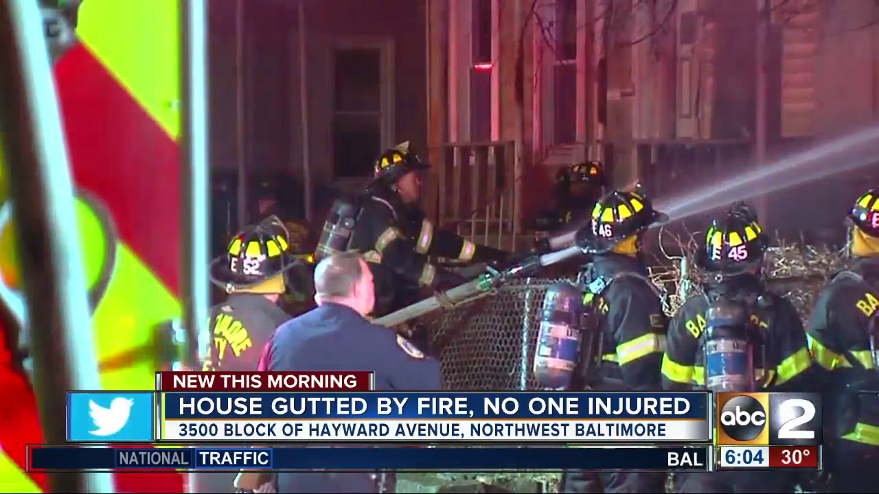 Three safely escape from massive Baltimore house fire