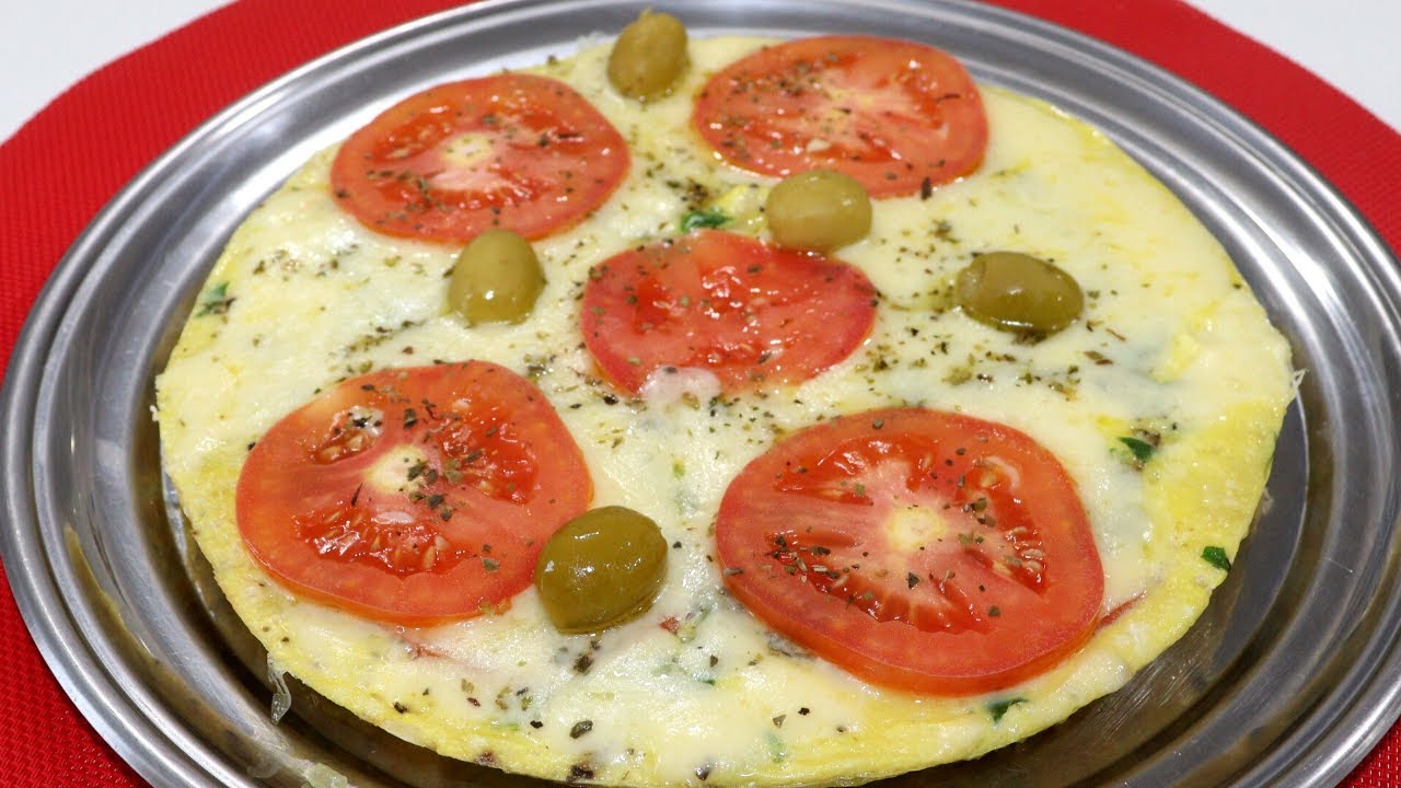 PARECE PIZZA, TEM GOSTO DE PIZZA MAS SÃO OVOS COM TOMATE!